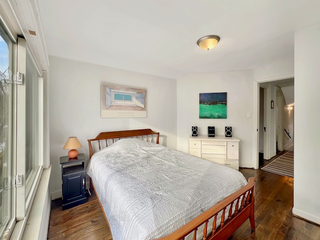 bedroom featuring dark wood-type flooring