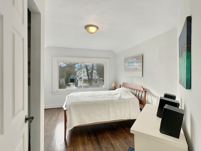 bedroom with dark wood-type flooring