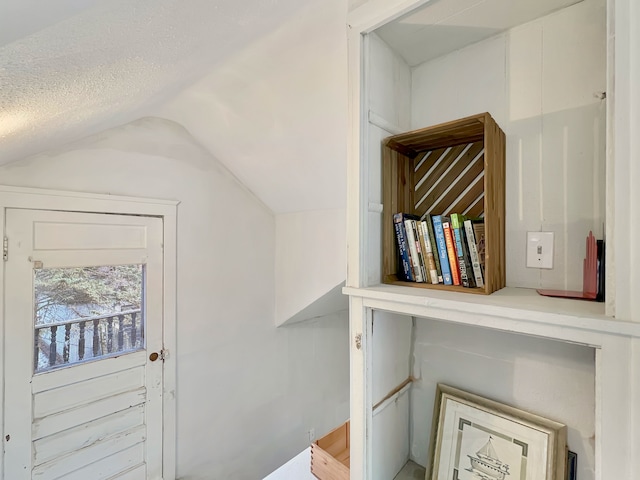 interior space featuring vaulted ceiling