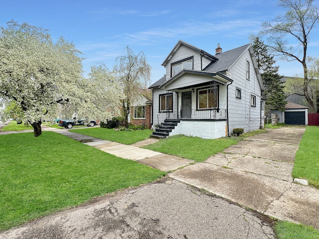 bungalow-style house with a garage, an outdoor structure, covered porch, and a front lawn