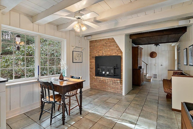 dining area featuring ceiling fan, wood ceiling, and beam ceiling