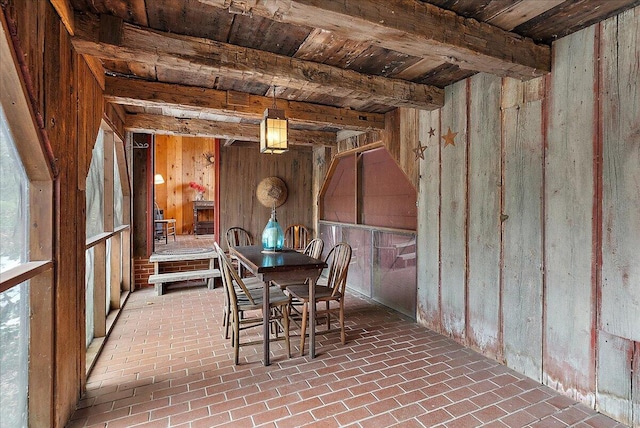 dining area with beamed ceiling and wooden ceiling