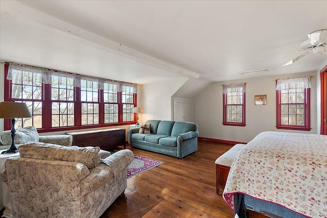 bedroom with dark hardwood / wood-style floors and lofted ceiling with beams