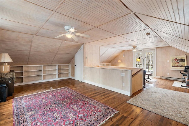 bonus room with built in shelves, wood walls, vaulted ceiling, wooden ceiling, and hardwood / wood-style flooring