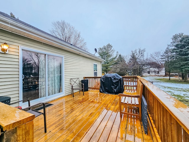 wooden deck featuring area for grilling