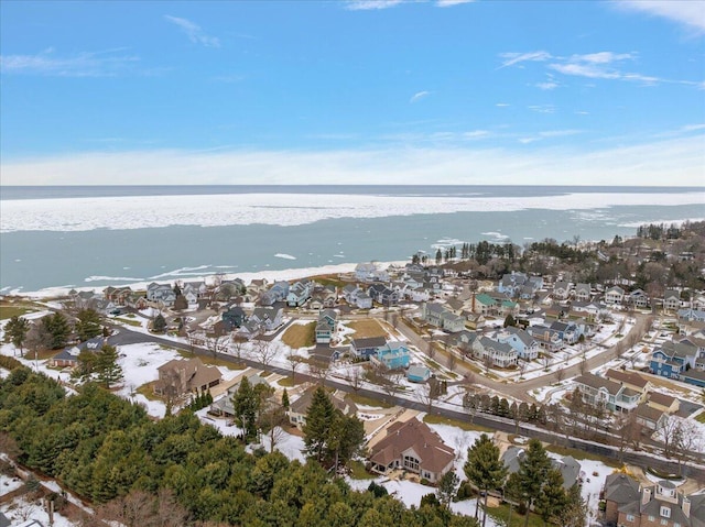 aerial view with a water view and a beach view