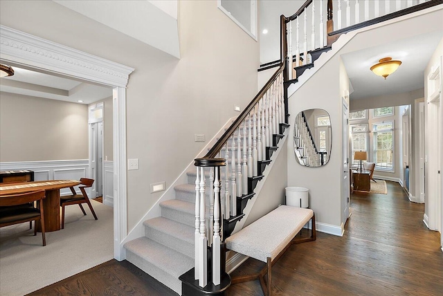 staircase featuring hardwood / wood-style floors