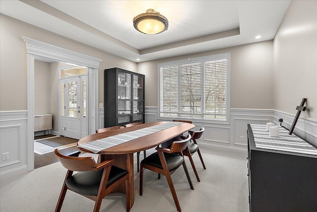 dining area featuring plenty of natural light and carpet floors