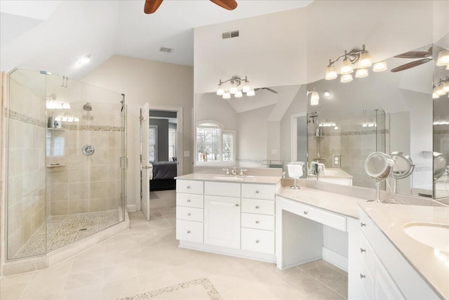 bathroom featuring walk in shower, ceiling fan, vanity, and vaulted ceiling