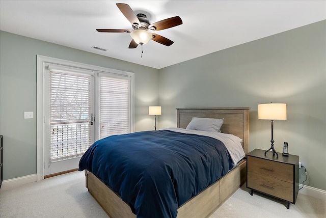 bedroom featuring ceiling fan, light colored carpet, and access to outside