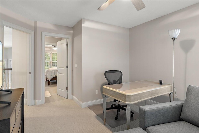 office with ceiling fan and light colored carpet