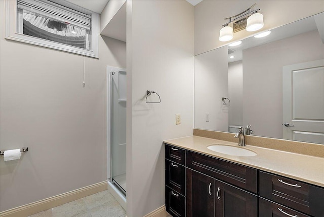 bathroom featuring vanity, tile patterned floors, and a shower with shower door