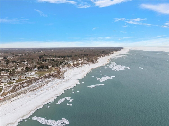 birds eye view of property with a view of the beach and a water view