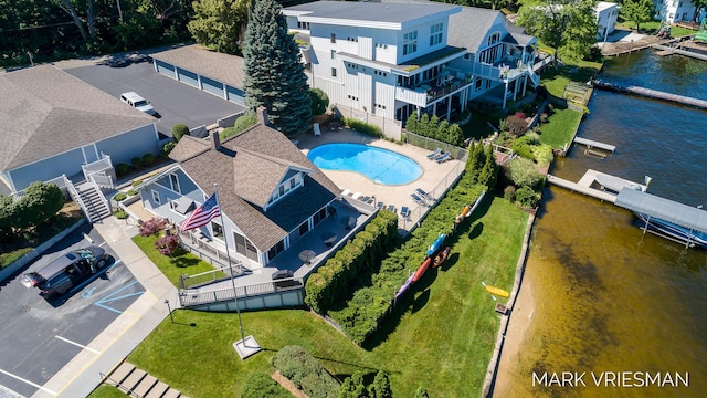 birds eye view of property with a water view