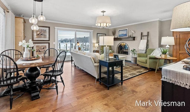 living room with crown molding and light wood-type flooring