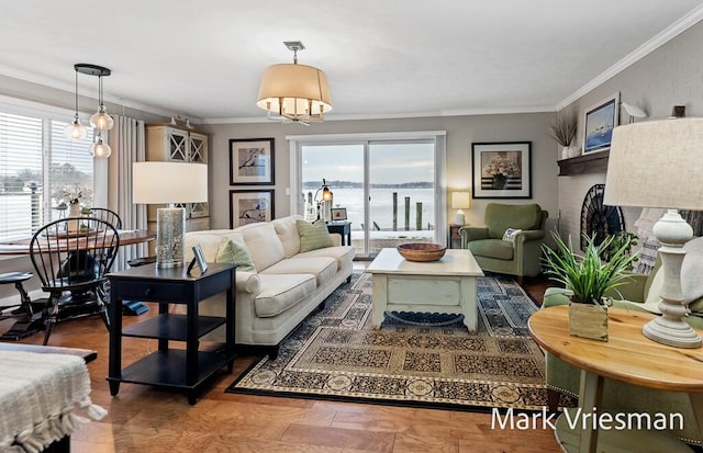 living room featuring ornamental molding and a water view