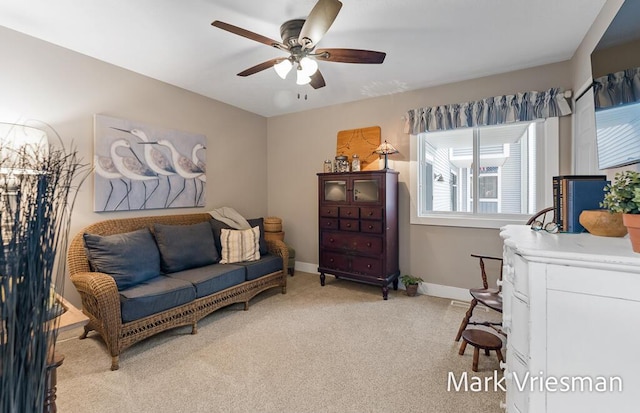 interior space with light colored carpet and ceiling fan