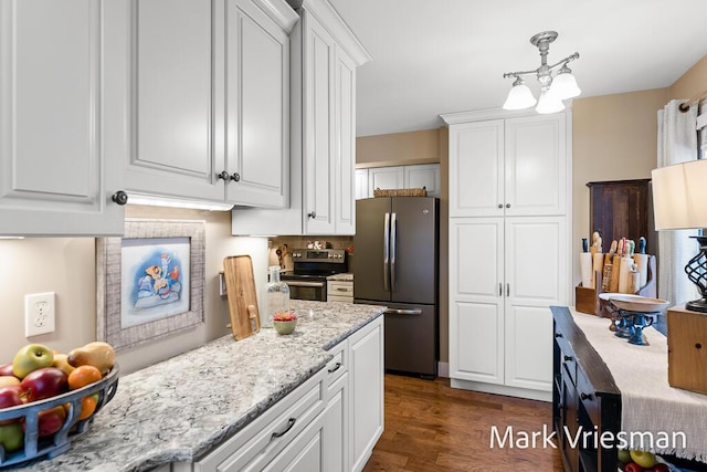 kitchen with stainless steel appliances and white cabinets