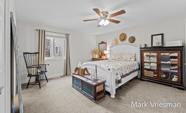 bedroom with ceiling fan and carpet flooring