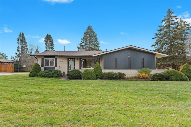 ranch-style house with a front lawn