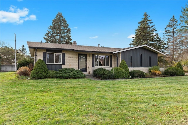 ranch-style house with a front lawn