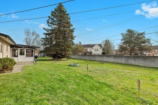 view of yard with a sunroom