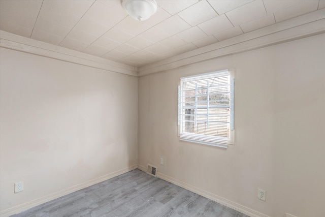 spare room with light wood-type flooring