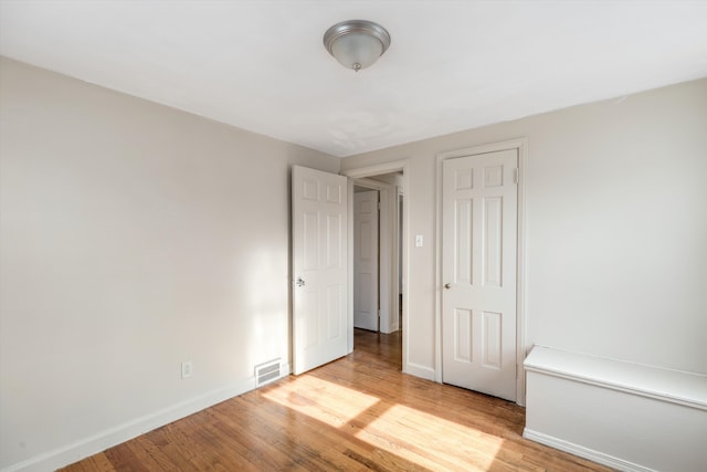 unfurnished bedroom with light hardwood / wood-style floors