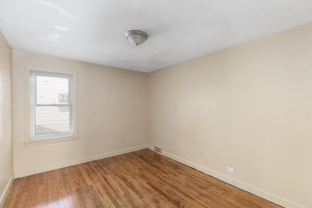 empty room featuring hardwood / wood-style floors