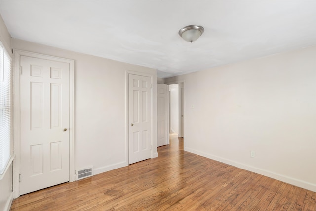 unfurnished bedroom with light hardwood / wood-style floors