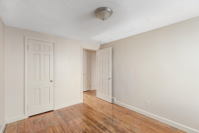 unfurnished bedroom featuring light wood-type flooring