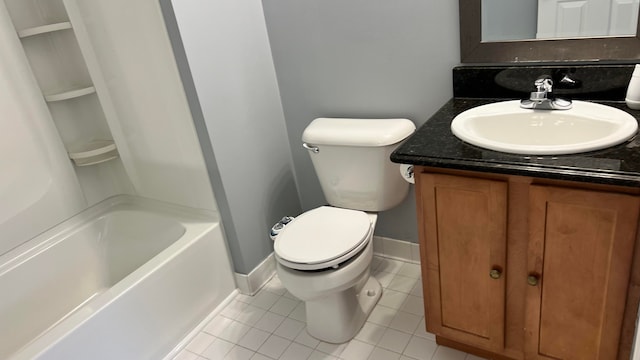 bathroom with vanity, tile patterned floors, and toilet