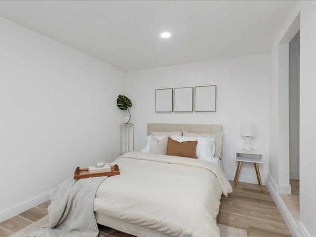 bedroom with light wood-type flooring