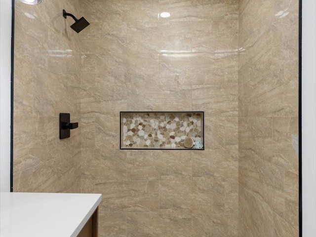 bathroom featuring tiled shower