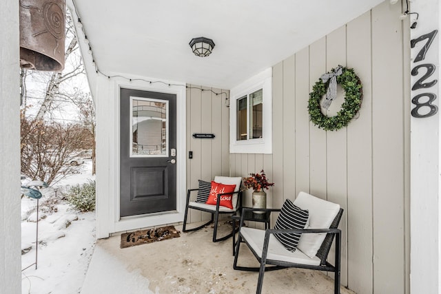 view of snow covered property entrance