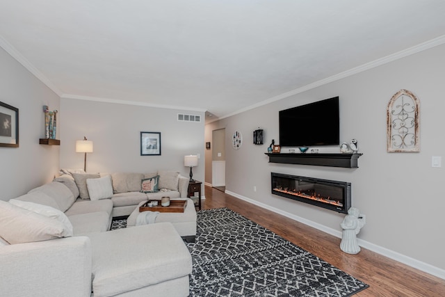 living room with crown molding and hardwood / wood-style flooring