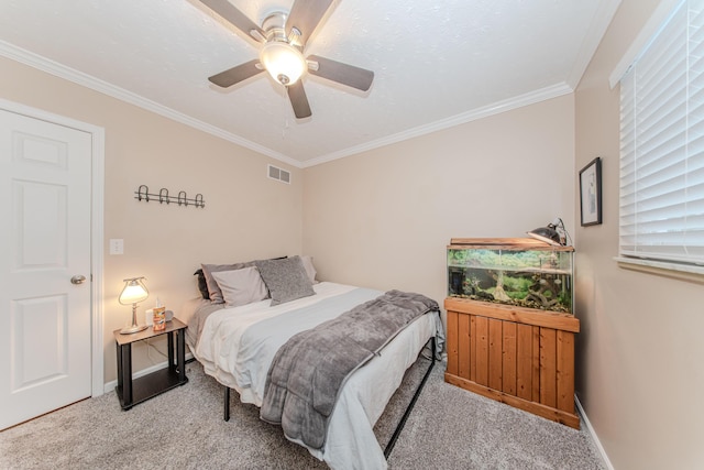 bedroom with crown molding, light colored carpet, and ceiling fan