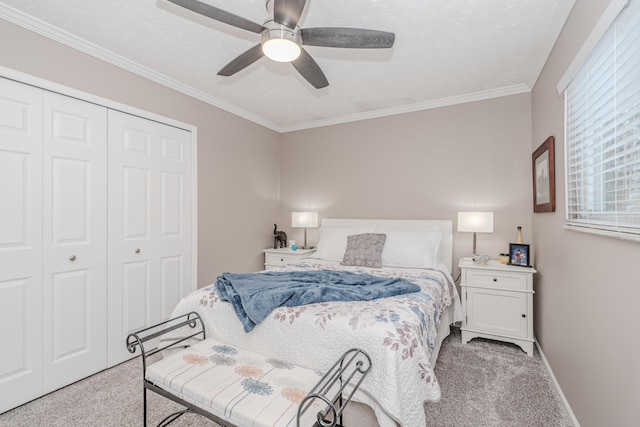 bedroom featuring crown molding, light colored carpet, ceiling fan, and a closet