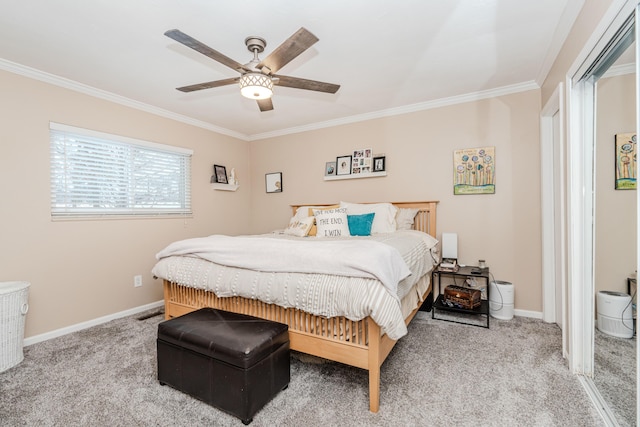 bedroom featuring ceiling fan, ornamental molding, and carpet floors