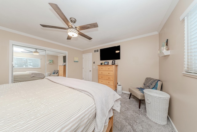 bedroom featuring crown molding, ceiling fan, and carpet floors