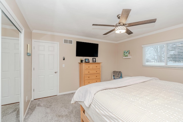 bedroom featuring ceiling fan, light colored carpet, and ornamental molding