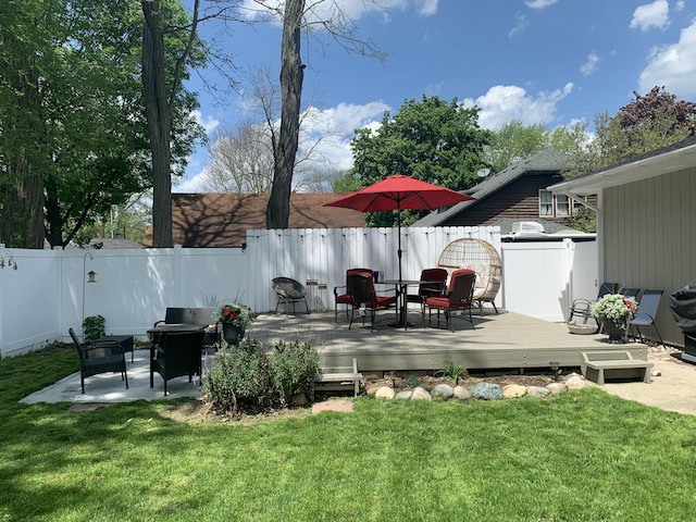 deck featuring a lawn