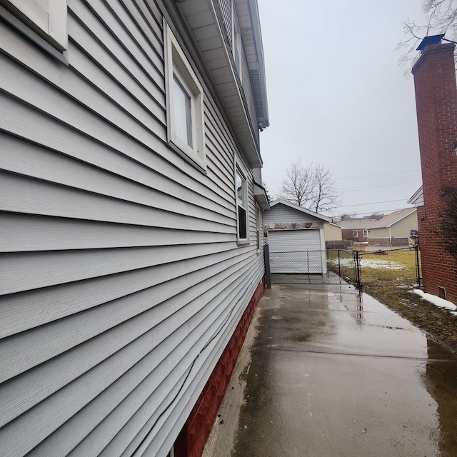 view of home's exterior featuring a garage and an outdoor structure