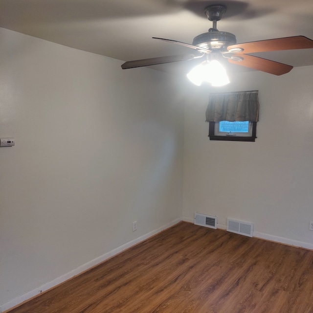 unfurnished room with hardwood / wood-style flooring and ceiling fan