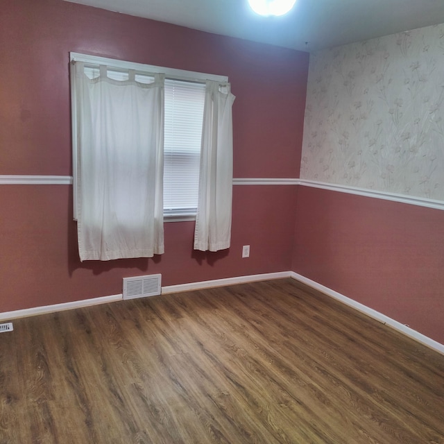 empty room with wood-type flooring