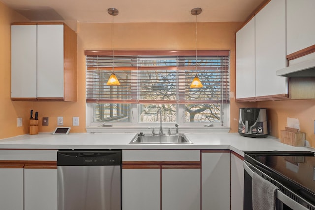 kitchen featuring dishwasher, a sink, and white cabinetry