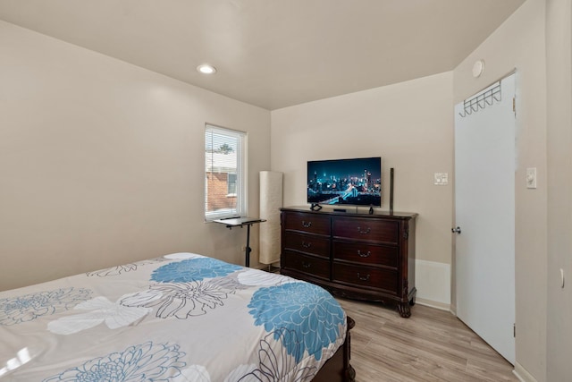 bedroom with light wood-type flooring and recessed lighting