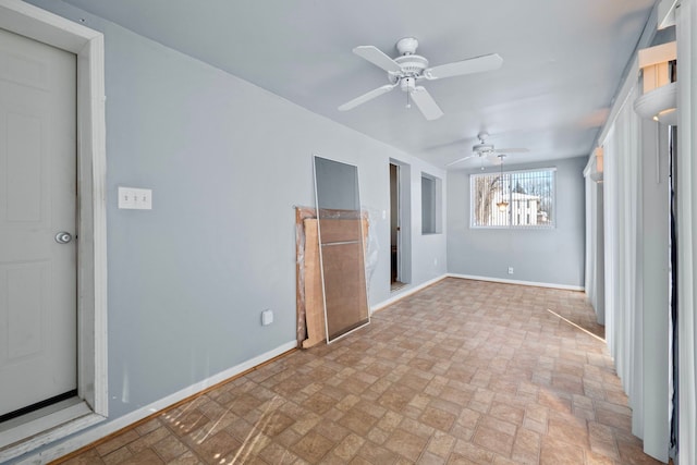 unfurnished bedroom featuring ceiling fan and baseboards