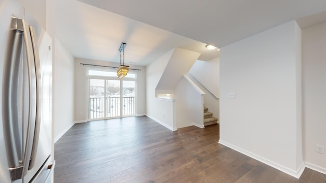 additional living space with dark hardwood / wood-style floors