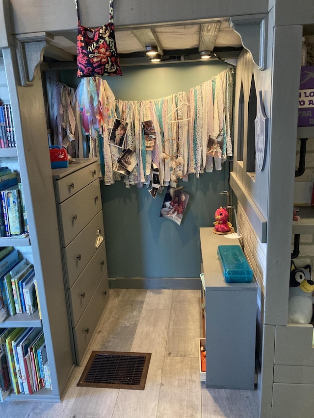 walk in closet featuring light wood-type flooring